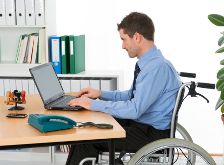 typing man on a wheelchair